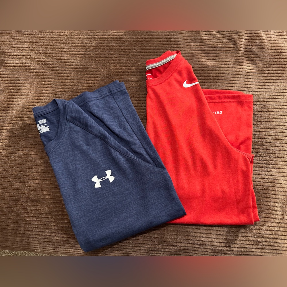 One Nike Red Dri-FIT Shirt / one Under Armour blue shirt. Both men’s small